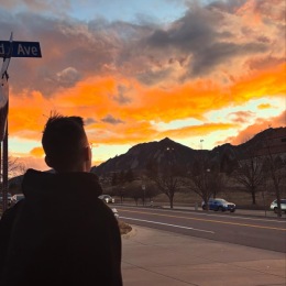 a sunset with mountains
