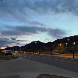 a sunset with mountains