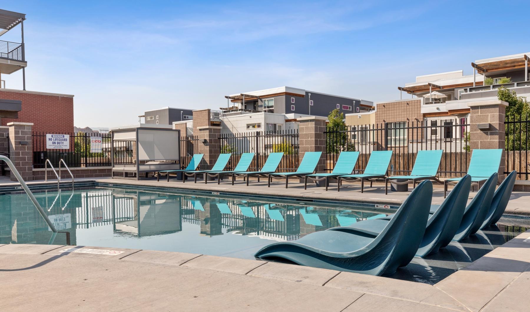 a pool with chairs around it