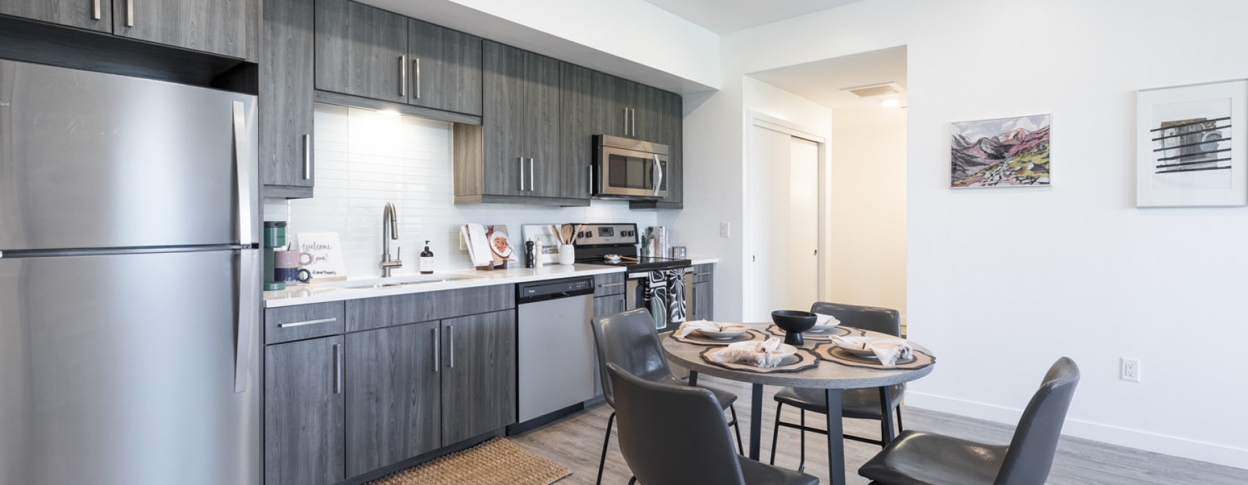 a kitchen with a table and chairs
