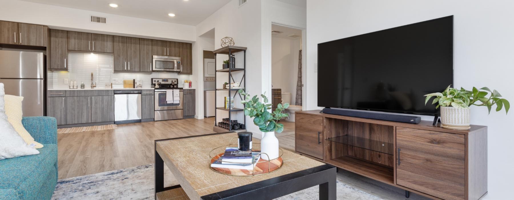 a living room with a tv and a table